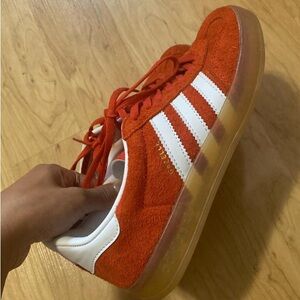 Red adidas gazelle gum sole sneakers